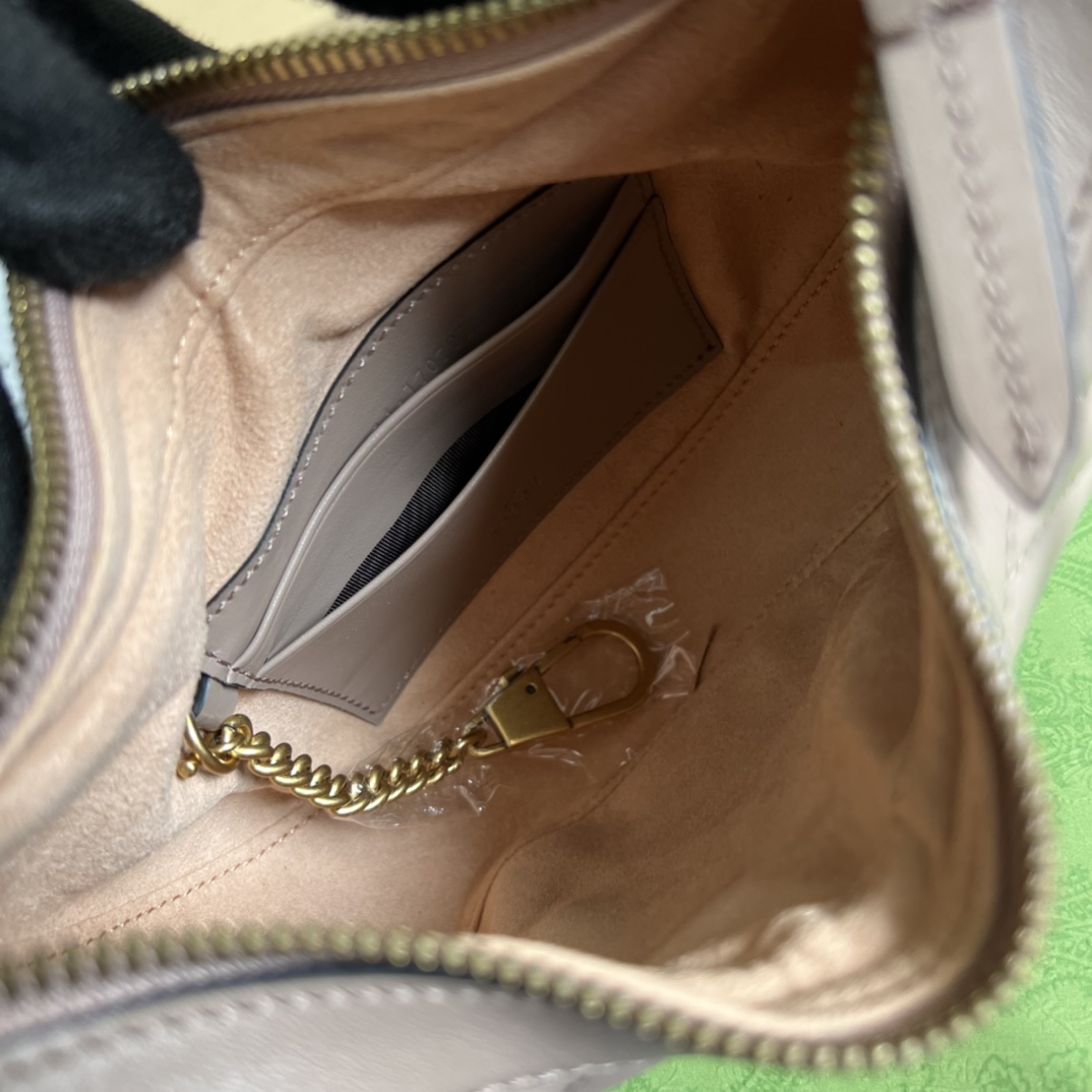 This mini handbag features a crescent-shaped silhouette and high-quality black leather, exuding a rich retro style. - Image 3