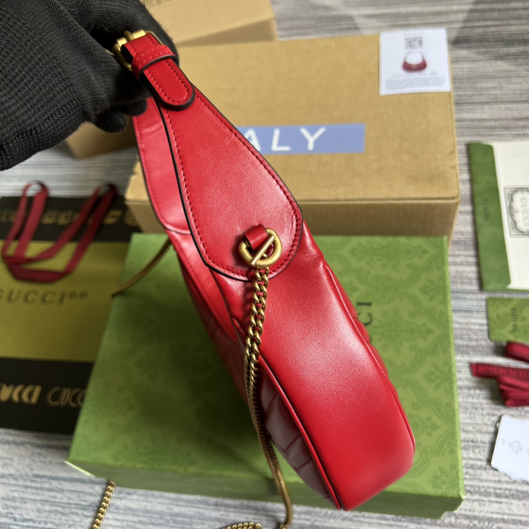 This mini handbag features a crescent-shaped silhouette and luxurious black leather, exuding a rich vintage style. - Image 2