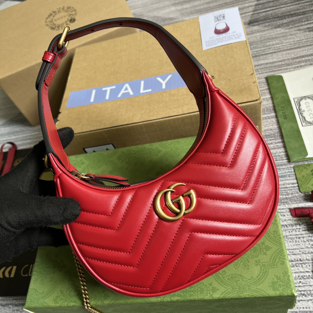 This mini handbag features a crescent-shaped silhouette and luxurious black leather, exuding a rich vintage style. - Image 4