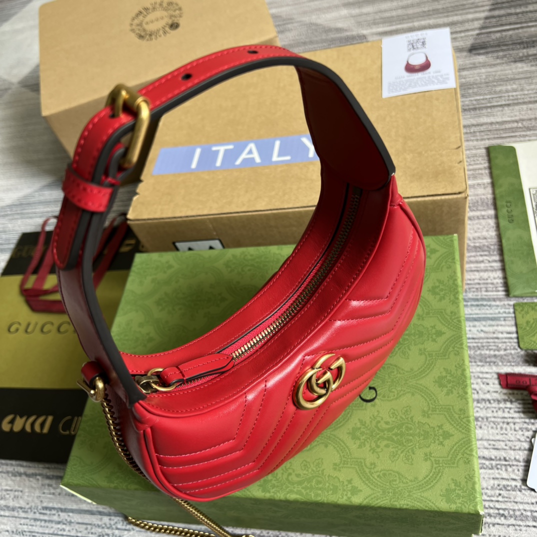 This mini handbag features a crescent-shaped silhouette and luxurious black leather, exuding a rich vintage style. - Image 5