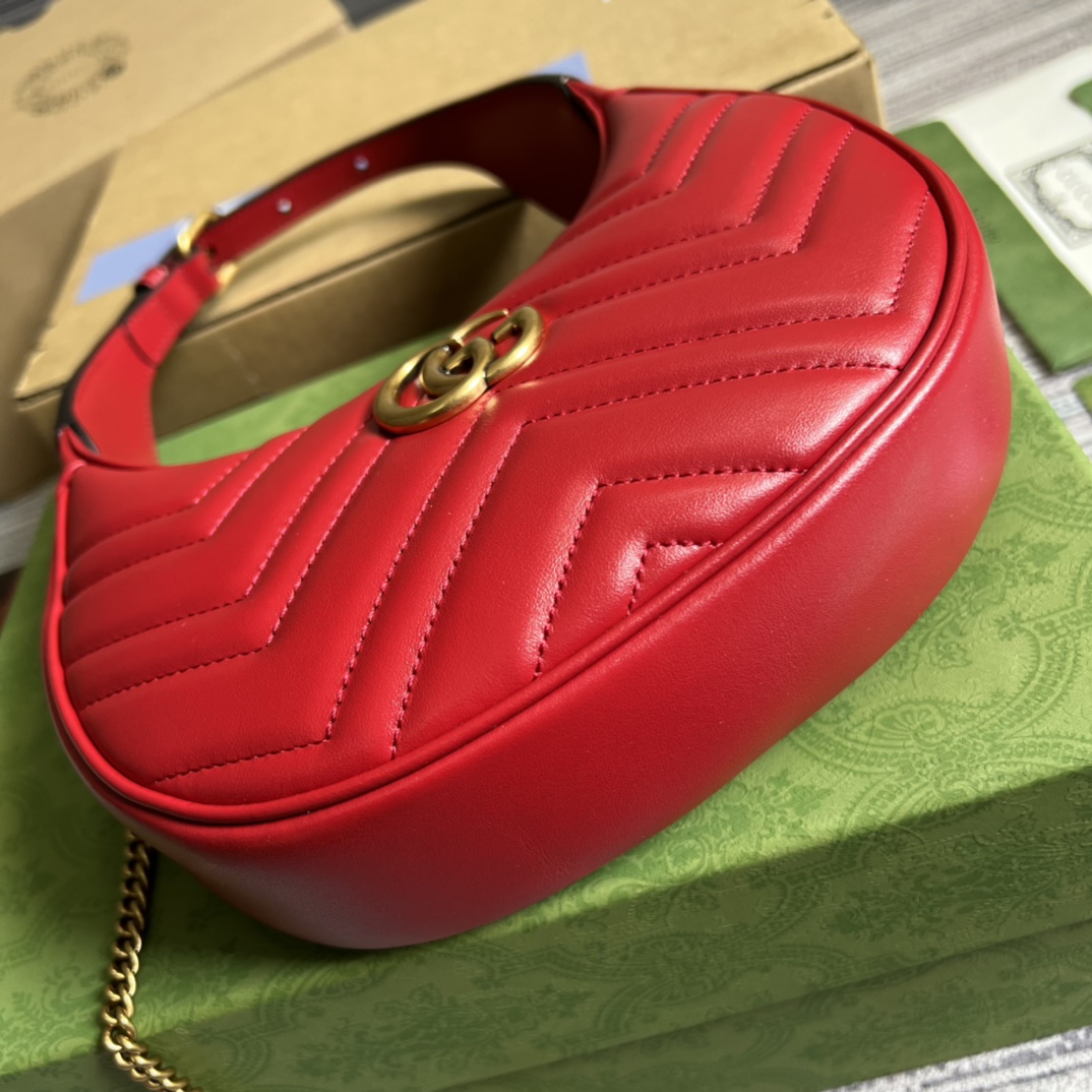This mini handbag features a crescent-shaped silhouette and luxurious black leather, exuding a rich vintage style. - Image 3