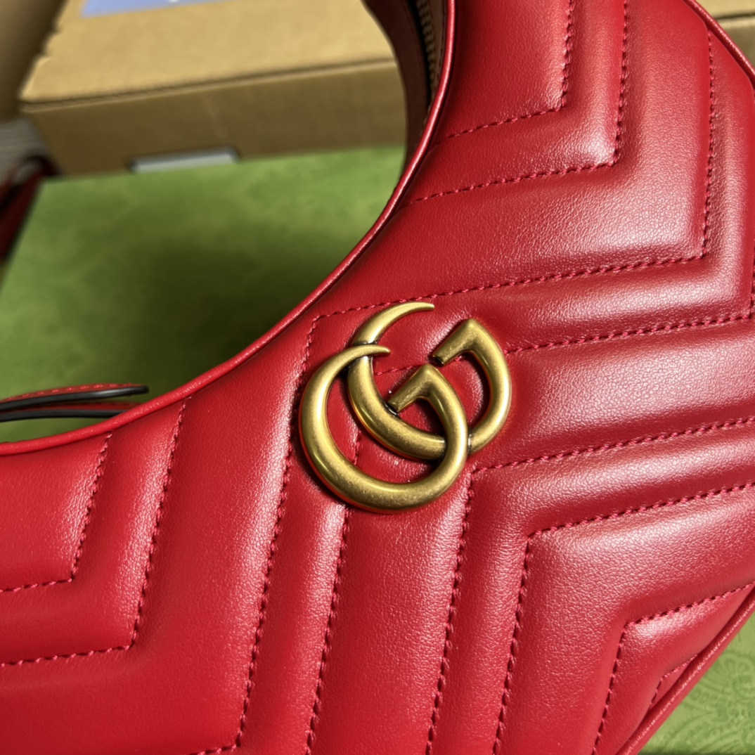 This mini handbag features a crescent-shaped silhouette and luxurious black leather, exuding a rich vintage style. - Image 9