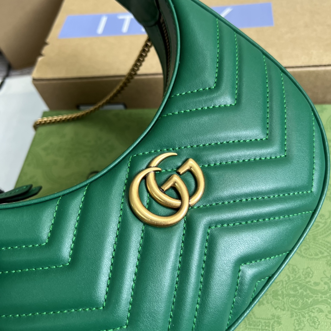 This mini handbag features a crescent-shaped silhouette and luxurious black leather, exuding a rich vintage style. - Image 2