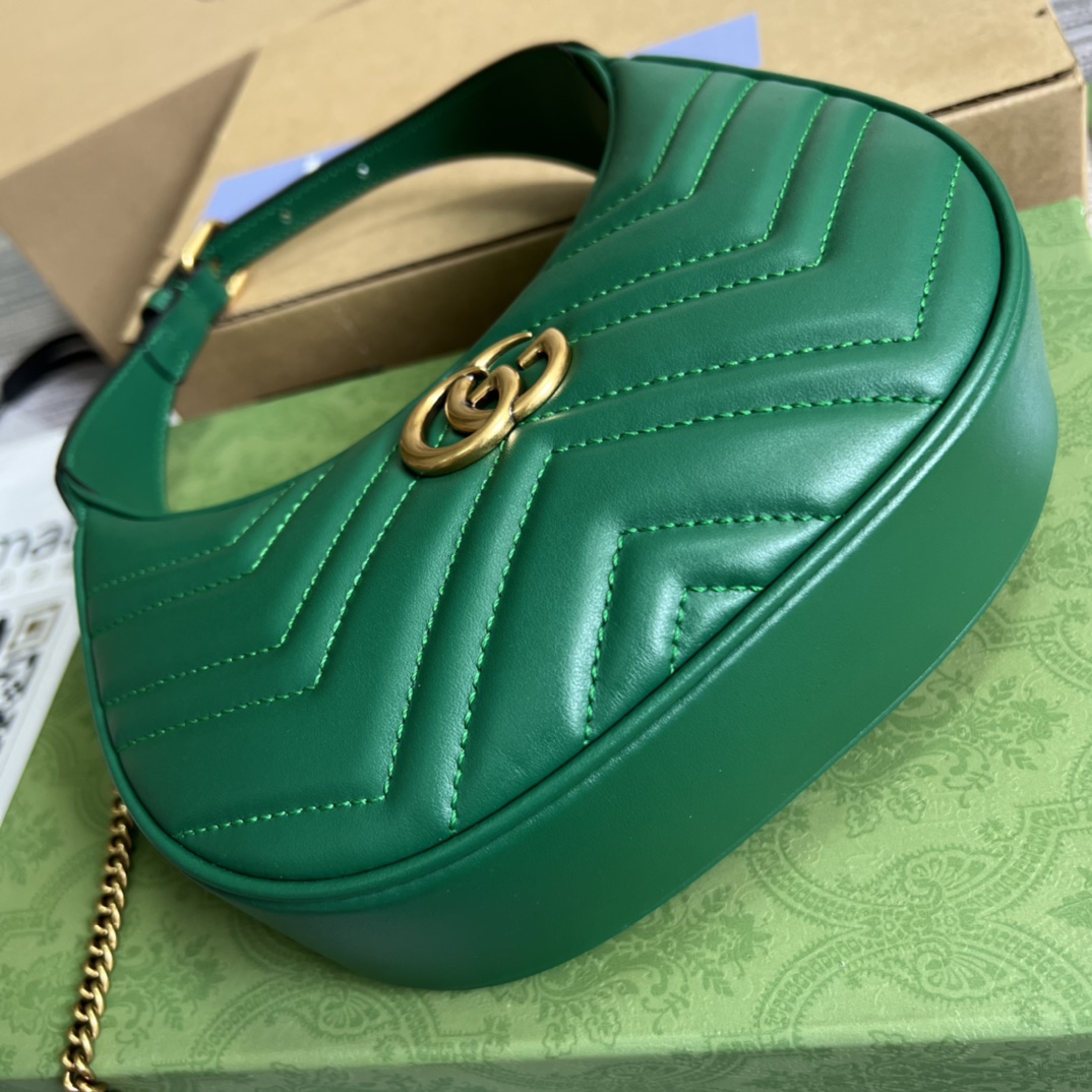 This mini handbag features a crescent-shaped silhouette and luxurious black leather, exuding a rich vintage style. - Image 4