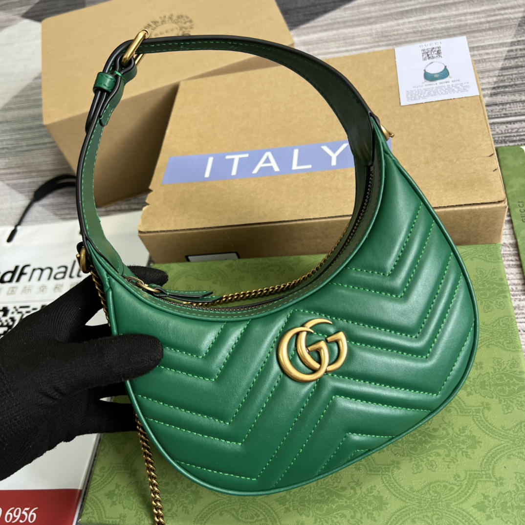 This mini handbag features a crescent-shaped silhouette and luxurious black leather, exuding a rich vintage style. - Image 7