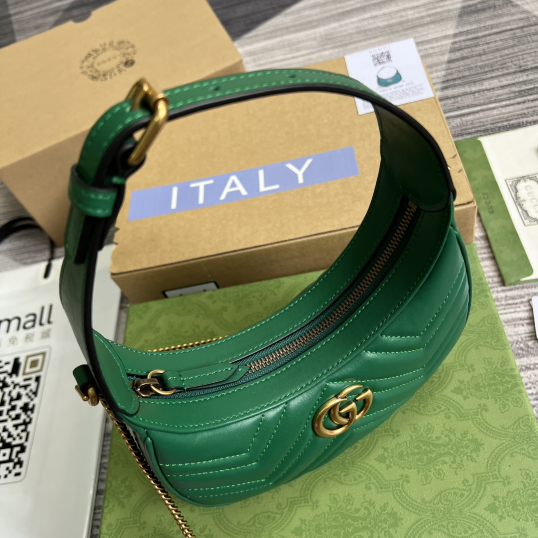 This mini handbag features a crescent-shaped silhouette and luxurious black leather, exuding a rich vintage style. - Image 9